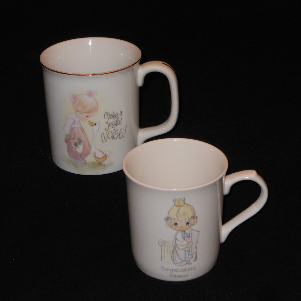 2 coffee mugs. Precious Moments beautiful young girl